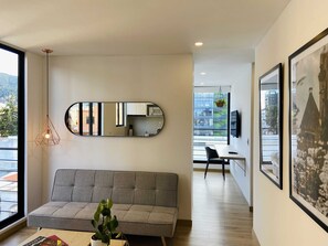 Senior Apartment | Living area | 40-inch Smart TV with cable channels - Capital by Wynwood House (Bogotá)