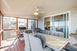 Enjoy al fresco dining and relaxation in this outdoor space, featuring a grill and comfortable seating.