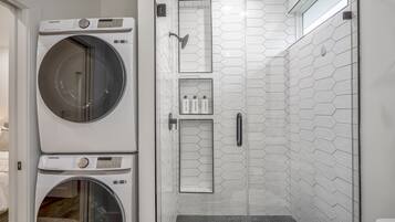 Shower, hair dryer, towels, soap
