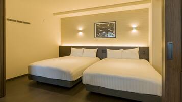 A hotel room with two beds, a wall-mounted artwork, and a ceiling light.