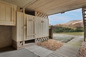 A wooden structure with a door, a sign indicating a beach view, and a pathway leading to a beach. - Coastal Comfort: Oceanfront Townhome, Ocean Views from King en Suite, Community Pool and Tennis (Nags Head)