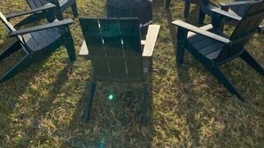 A lakeside seating area with Adirondack chairs and a fire pit, overlooking a dock and water. - Historic Waterfront Escape • Dock, Deck, Fire Pit, Views, Peace & Kayaks (Lancaster)