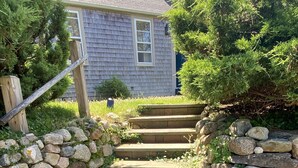 A stone staircase leading to a house with a sign reading "The Farm House at Fishers Landing EST. 1840". - Madaket Farmhouse- Walk to Beach and Sunsets- Near Bike Path -Nantucket (Nantucket)