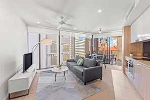 Apartment, 1 Bedroom, City View | Living area | Smart TV