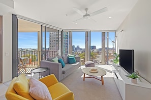 Apartment, 2 Bedrooms, City View | Living area | Smart TV