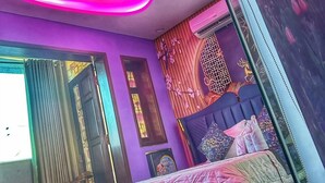 A bedroom with a bed, a window, and a door. - Nam Anh Hotel Phu Nhuan -by Bay Luxury (Ho Chi Minh City)