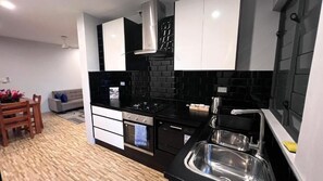 Deluxe Apartment | Private kitchen | Full-size fridge, microwave, oven, stovetop - Greystone Apartments (Nadi)