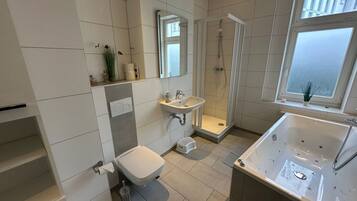 Shower, hair dryer, towels, soap