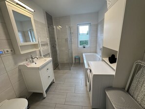 Shower, hair dryer, towels, soap