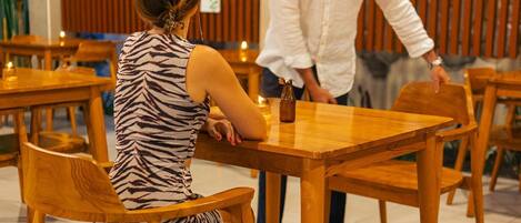 A restaurant with wooden furniture and a rustic decor.