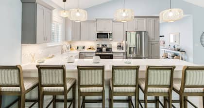 Luxurious 4-Bedroom Dog-Friendly Retreat in Oak Island w/ 6 Seater Golf Cart & 7 Person hot tub