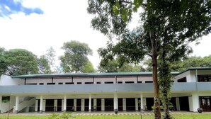 A modern building with a flat roof, multiple levels, and a covered entrance area. - Victoria Nature Resort Digana (Digana)
