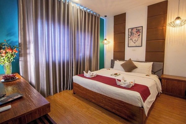 Junior suite | Een minibar, een kluis op de kamer, individueel gedecoreerd