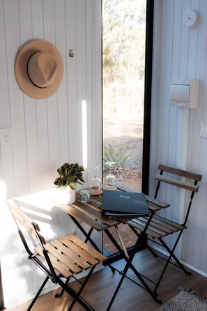 Work from a comfortable space with a desk and chair, and step outside to enjoy the surrounding landscape.