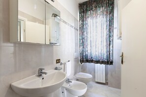 Shower, bidet, toilet paper
