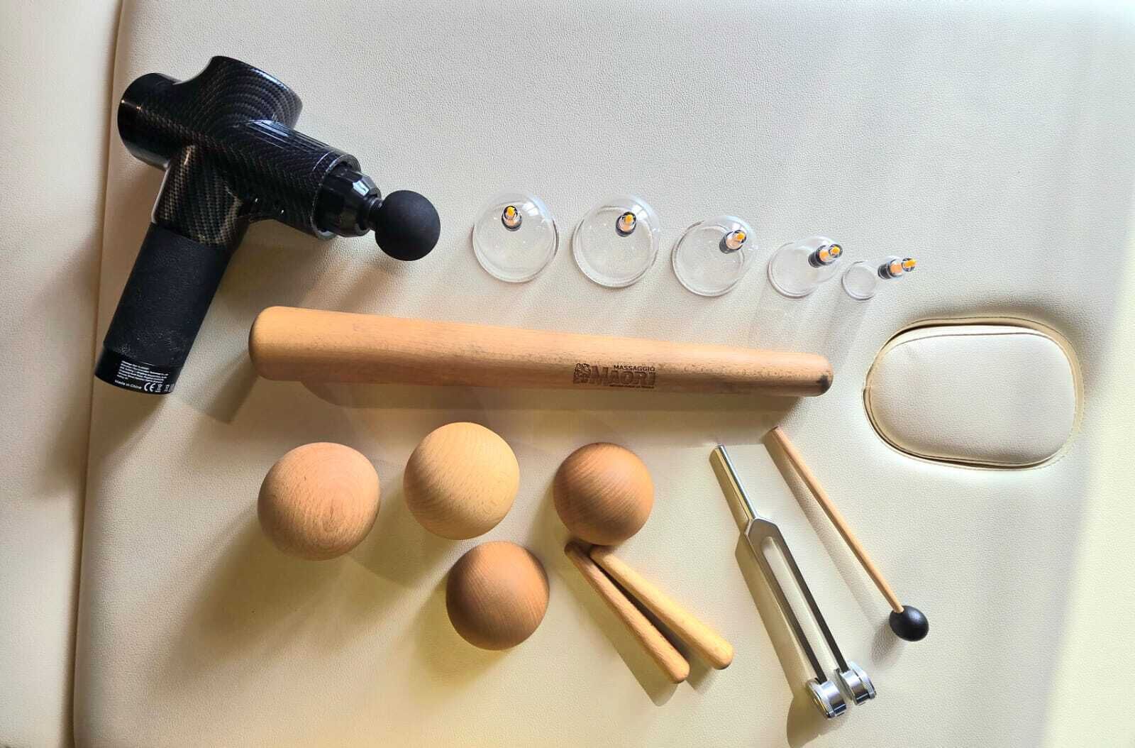 A set of makeup tools including a brush, a sponge, and a mirror.