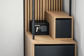 A secure storage unit with a combination lock and a keyhole, built into a wooden structure with vertical slats. - GBU Home  Olive Executive 403 (Timișoara)
