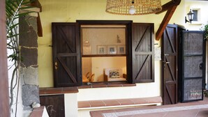 A stone wall with a window and a door. - Beachfront vacation home in elegant residential complex near Chia (Pula)