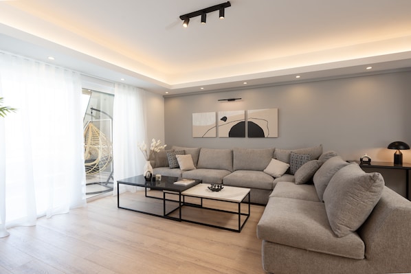 Luxury Apartment | Living area | 55-inch Smart TV with cable channels