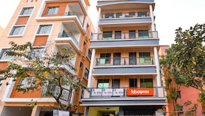 A multi-story building with balconies, a 'fabexpress' sign, and 'Rs Villa' signs. - Fabexpress Rs Villa (Barasat)