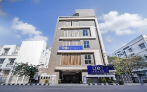 A modern hotel building with a sign for 'fabHOTELS' and 'Hotel Lio7 Grand'. - Fabhotel Lio7 Grand (Hyderabad)
