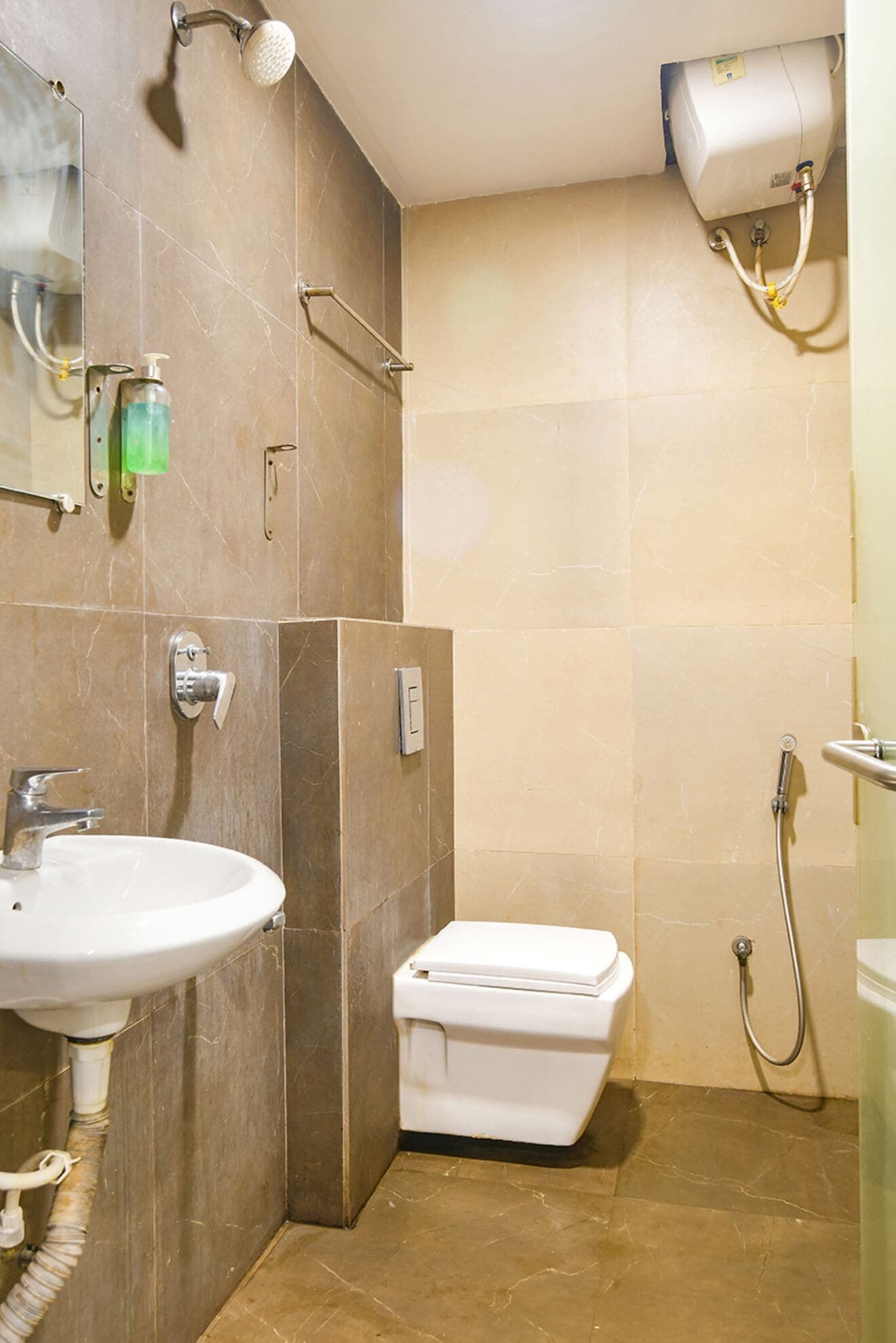 A bathroom with a sink, toilet, and shower.