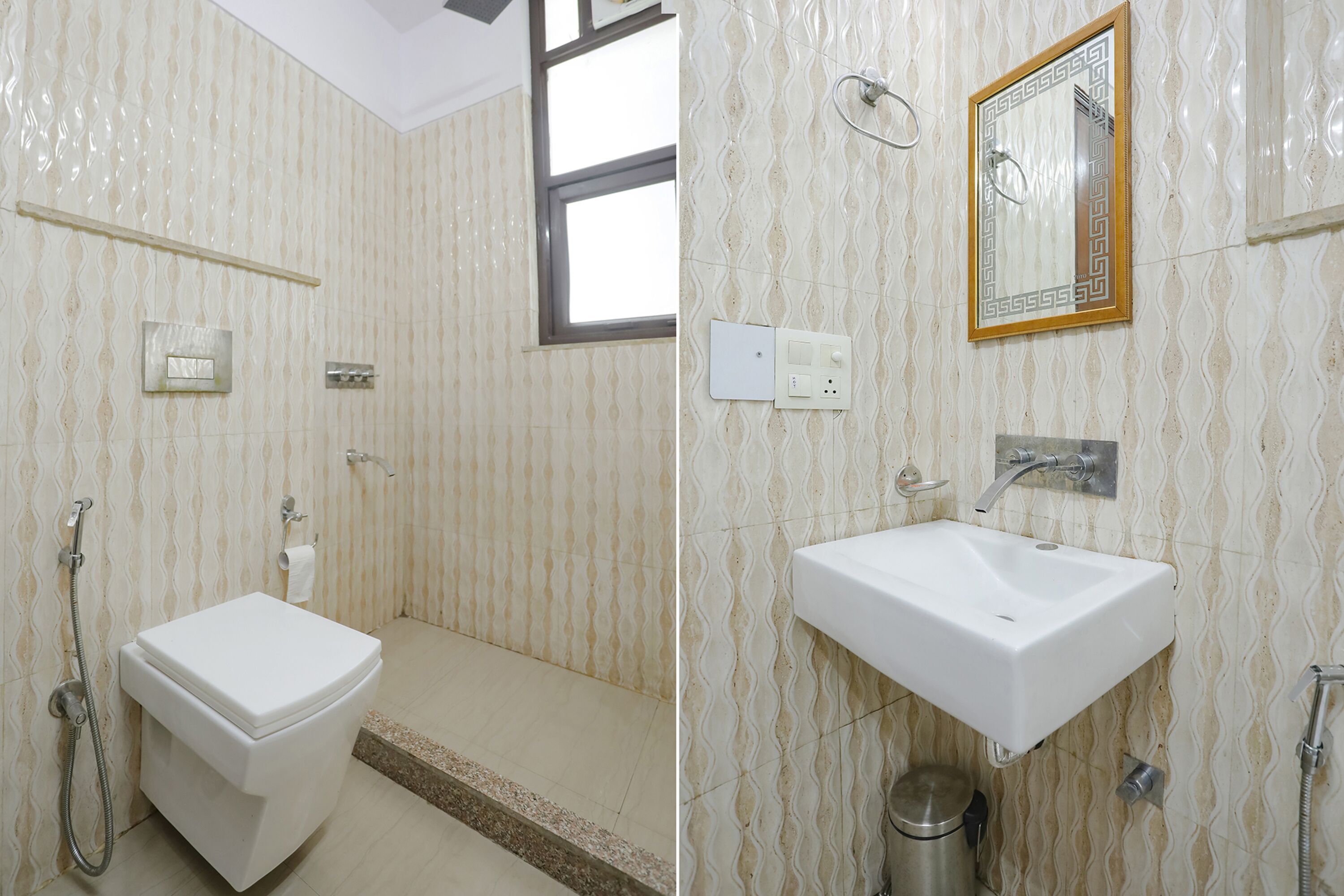 A bathroom with a toilet, shower, sink, and a mirror.