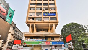A multi-story building with the name "Shriram Chambers" on the facade. - Fabhotel Rvg (Vadodara)