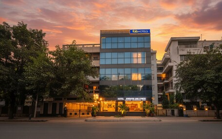 A modern hotel building with a sign for 'fabHOTELS' and 'HOTEL STRAMMI LOBE FITNESS'.