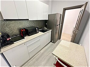 Private kitchen - One-Bedroom Apartment.....
 (Mamaia-Sat)