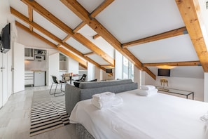 Deluxe Studio, 1 Queen Bed, Balcony, River View | In-room safe, individually decorated, individually furnished