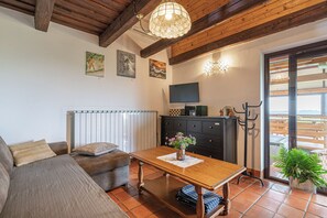 Family House, Multiple Bedrooms, Mountainside (Wellness Vineyard Cottage Marjan) | Living area | 21-inch flat-screen TV with digital channels, fireplace - Podhamer Wellness Vineyard Cottages (Ljutomer)