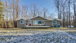 A single-story house with a front porch, a red door, and a large window. - Hines Vacation Rental w/ Grill: Walk to Lake! (Hines)