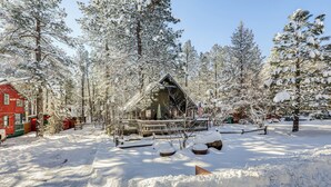 A cabin surrounded by snow-covered trees. - Munds Park Cabin w/ Deck & Fire Pit: Walk to Trail (Munds Park)
