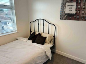 Casa | 2 dormitorios, escritorio, tabla de planchar con plancha y wifi gratis