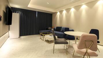 Premium bedding, free minibar items, desk, laptop workspace