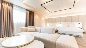 Premium bedding, free minibar items, desk, laptop workspace