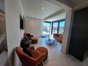 Appartamento | Area soggiorno | TV a schermo piatto 65 pollici con canali digitali, Netflix