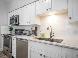 Oven, stovetop, coffee/tea maker, cookware/dishes/utensils