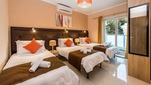 A hotel room with two beds, a large window, and a modern design. - Blue 2: Two-Bedroom Apartment in St. Julian's (Swieqi)