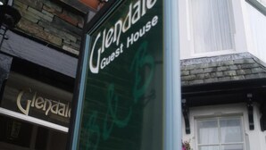 A sign for 'Glendale Guest House' with a phone number. - Glendale Guest House (Keswick)