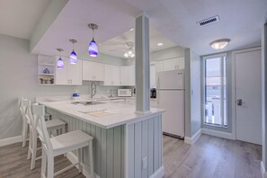 Condo, 1 King Bed with Sofa bed (Anna Maria Island Runaway Tropical Es) | Private kitchen | Highchair - Anna Maria Island Runaway Tropical Escape (Bradenton Beach)