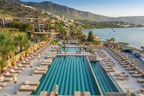 Outdoor pool, open 8:00 AM to 8:00 PM, pool umbrellas, pool loungers
