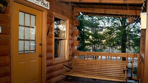 A wooden porch with a bench, a door, and a sign that reads "Porch." - Visit Mountain Getaway for Labor Day! - Hot Tub - Fiber Wifi - Callaway (Warm Springs)