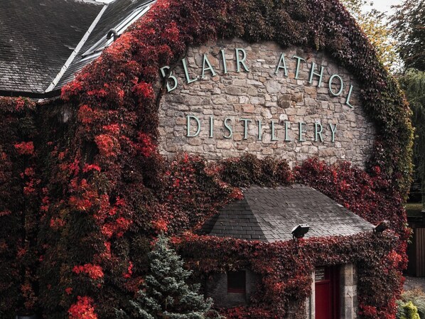 A stone building with a sign that reads 'Blair Athol Distillery.' - Heilan Roo (Pitlochry)
