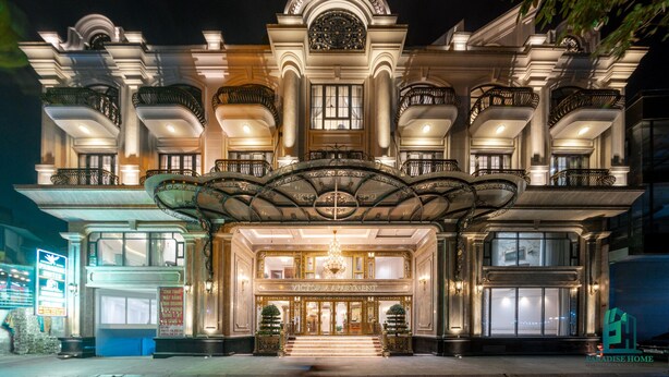 A grand building with a central entrance, ornate balconies, and a chandelier. - Victoria Apartment Paradise Suites (Hanoi)