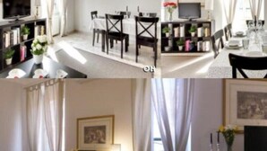 Un coin repas avec une table dressée pour quatre personnes, un téléviseur et une bibliothèque contenant des livres et des objets décoratifs.