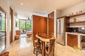 Enjoy cooking in this well-equipped kitchen with a central island, stainless steel appliances, and ample storage.