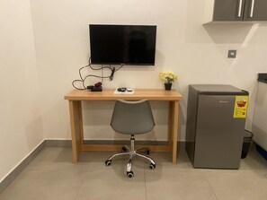 Estudio ejecutivo | Zona de estar | Una Smart TV, Netflix, servicios de streaming, un reproductor estéreo