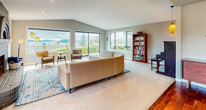 Water-view home with ADU, gated entry, hot tub, enclosed yard, deck, & 2 W/Ds